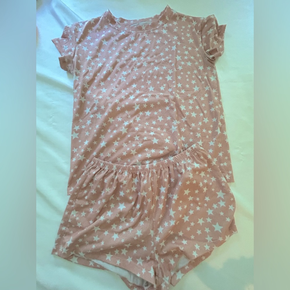 Cute Coral pajamas with white stars, size small.